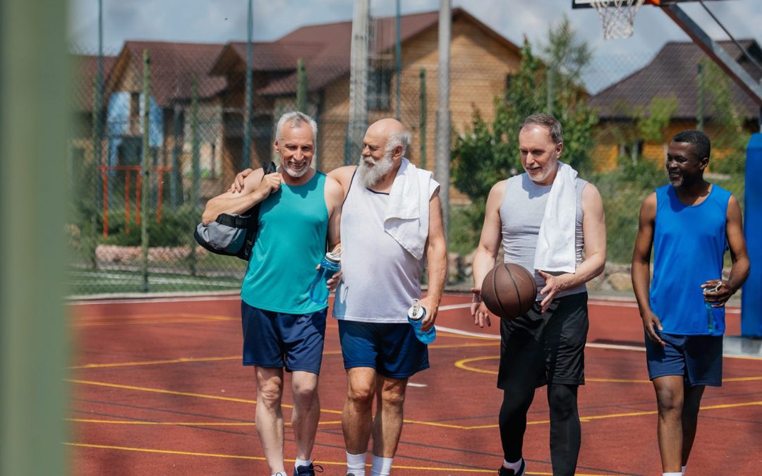 Elderly men with basketball on playground